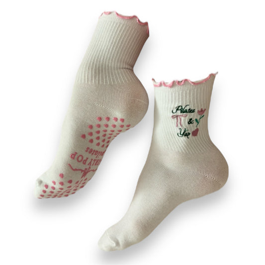 Pink pilates grip socks with ruffles, hearts, bows and flowers. Girly and non-slip. 